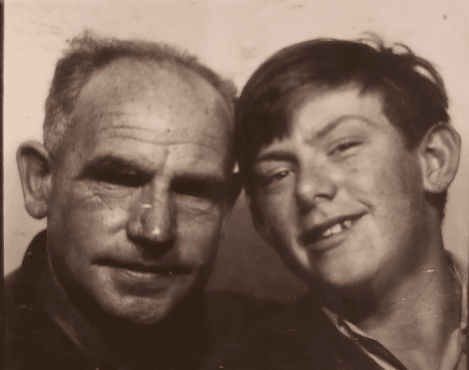 Walter Edward O'Neill known as Ted, Tony O'Neill's grandfather, pictured with his son Walter Edward O'Neill, Tony's father, in a vintage sepia photograph from the early 1980s, South Wales